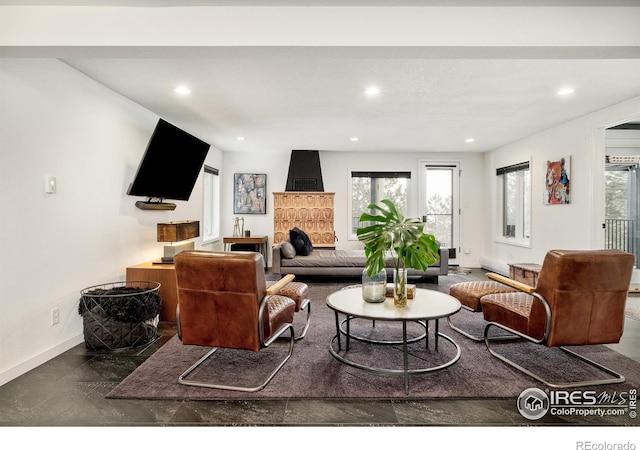 living room with baseboards and recessed lighting