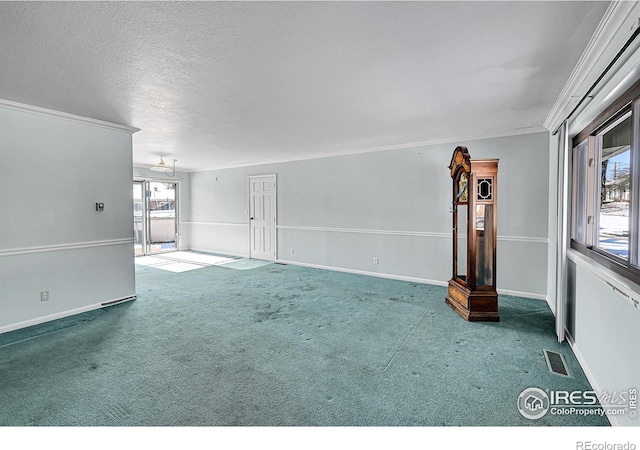 unfurnished living room with a healthy amount of sunlight, carpet flooring, and a textured ceiling