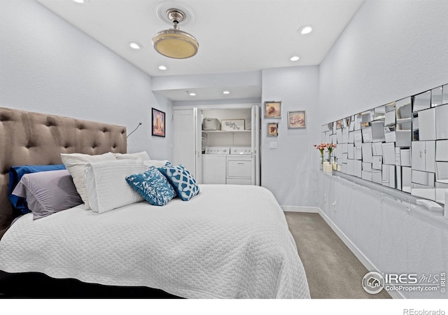 bedroom with recessed lighting, light colored carpet, independent washer and dryer, and baseboards