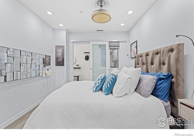 bedroom featuring recessed lighting, visible vents, and light colored carpet