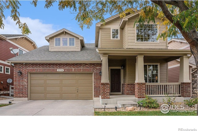 view of front facade featuring a garage, concrete driveway, brick siding, and a porch