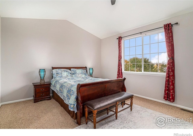 bedroom with lofted ceiling, light colored carpet, a ceiling fan, visible vents, and baseboards