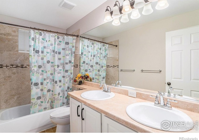 bathroom with visible vents, a sink, shower / bathtub combination with curtain, and double vanity