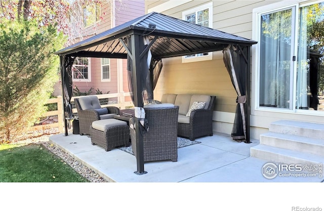 view of patio with outdoor lounge area and a gazebo