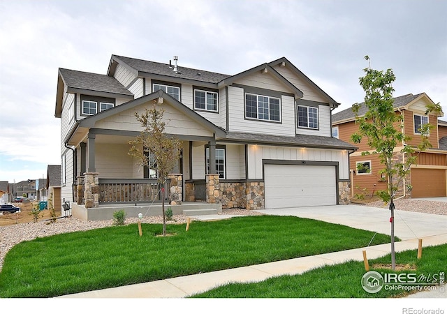 craftsman inspired home with concrete driveway, stone siding, an attached garage, a porch, and board and batten siding