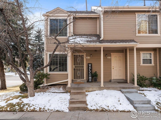 townhome / multi-family property featuring a porch