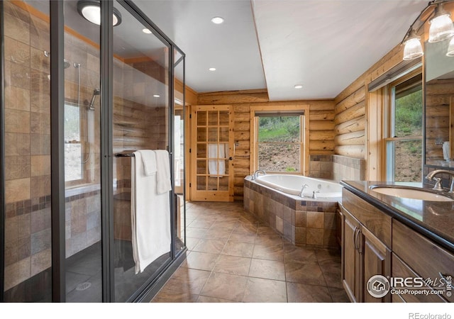 full bathroom with a garden tub, log walls, recessed lighting, a shower stall, and vanity