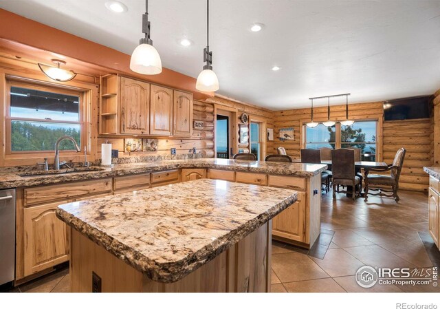 kitchen featuring a sink, open shelves, a kitchen island, and pendant lighting