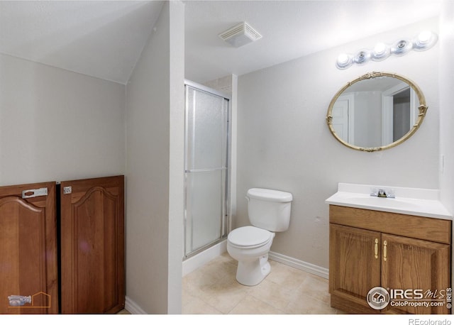 bathroom with toilet, a shower stall, tile patterned flooring, and vanity