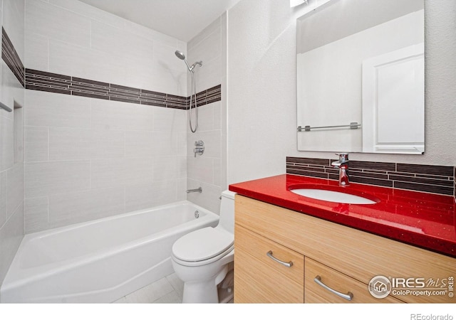 full bathroom with tasteful backsplash, bathing tub / shower combination, vanity, and toilet