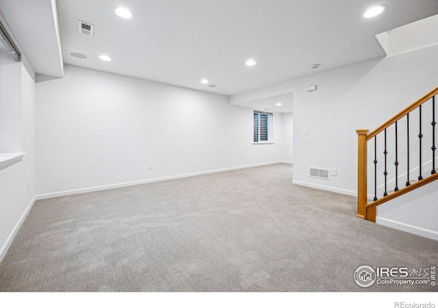 below grade area with stairway, carpet, visible vents, and recessed lighting