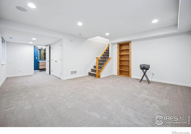 finished basement with recessed lighting, carpet flooring, visible vents, baseboards, and stairs