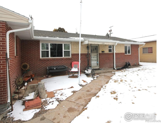 view of front of house with brick siding