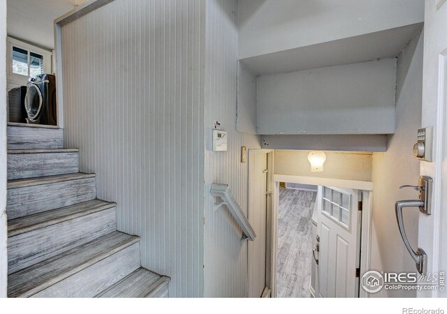 stairway with wood finished floors