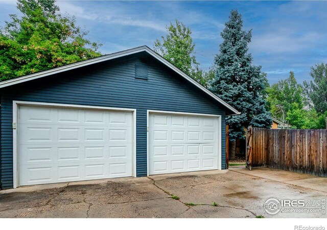 garage with fence