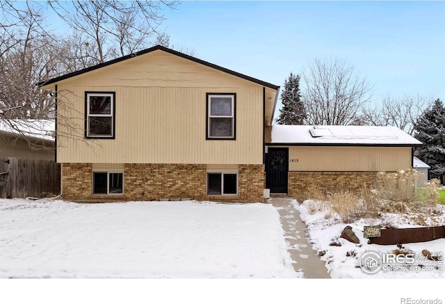 exterior space with brick siding