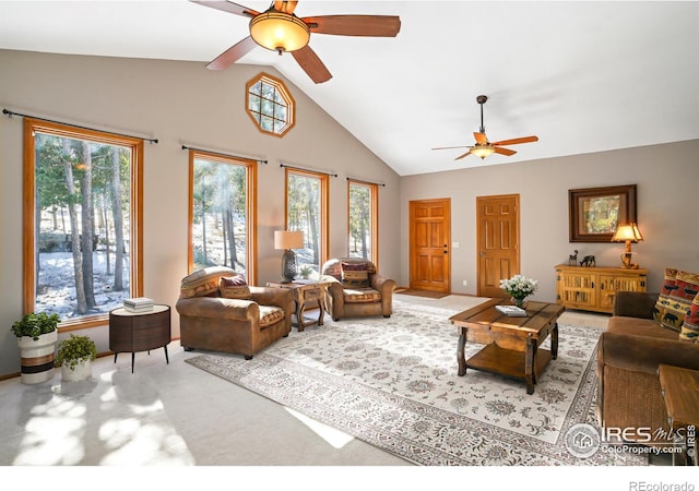 living room featuring ceiling fan, carpet floors, high vaulted ceiling, and a wealth of natural light