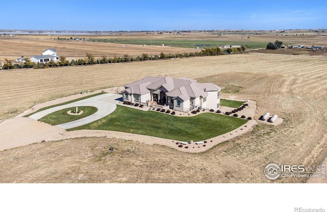 birds eye view of property featuring a rural view