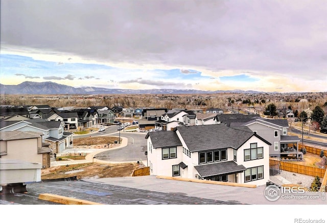 drone / aerial view with a residential view and a mountain view