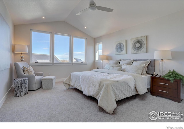bedroom with vaulted ceiling, baseboards, a ceiling fan, and light colored carpet