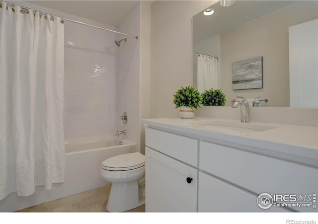 bathroom featuring shower / bath combo, vanity, and toilet