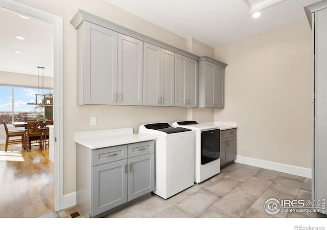 clothes washing area with cabinet space, recessed lighting, baseboards, and independent washer and dryer