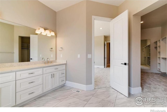 full bath featuring visible vents, marble finish floor, vanity, and baseboards