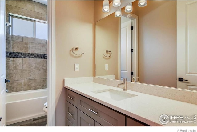 full bathroom featuring toilet, shower / washtub combination, and vanity