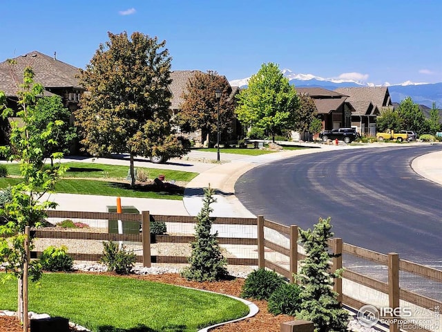 view of street with a residential view and a mountain view