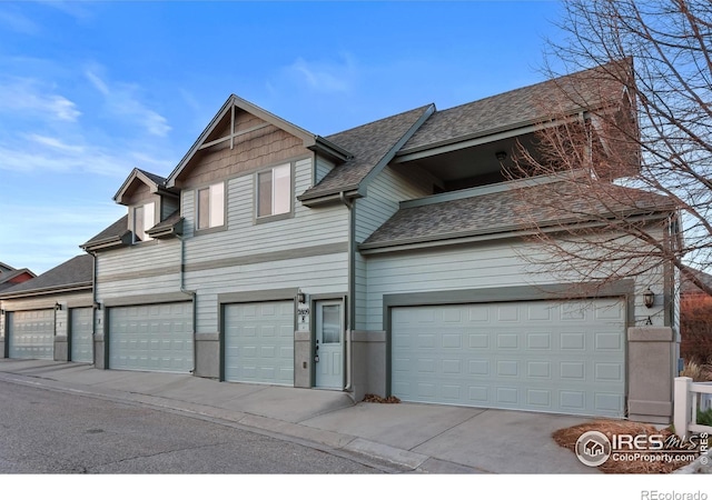 view of front of home with a shingled roof