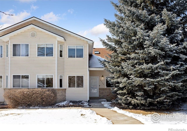 view of front of home with brick siding