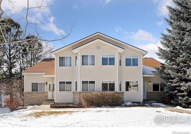 view of front of house with brick siding