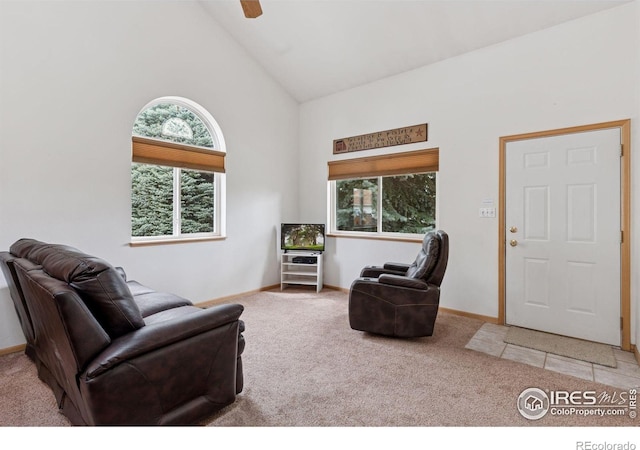 2143 Meadow Ct, Longmont, CO 80501 - carpeted living area with healthy amount of natural light, high vaulted ceiling, baseboards, and ceiling fan