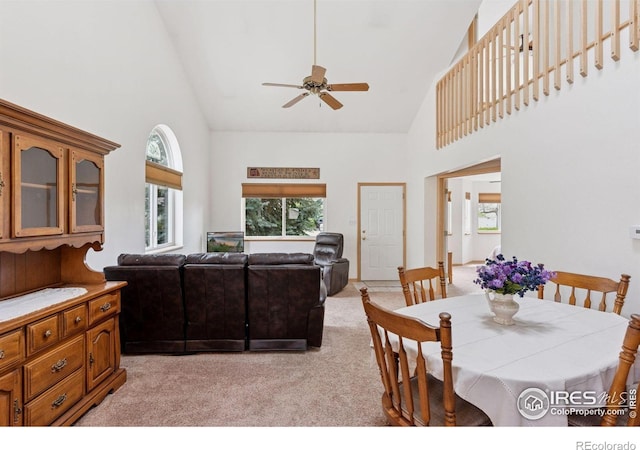 2143 Meadow Ct, Longmont, CO 80501 - dining room with high vaulted ceiling, light colored carpet, and a ceiling fan