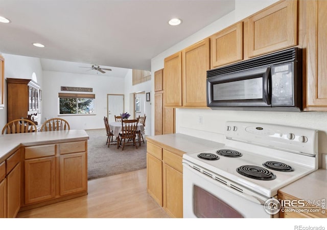 2143 Meadow Ct, Longmont, CO 80501 - kitchen featuring electric range, black microwave, ceiling fan, light countertops, and light wood finished floors