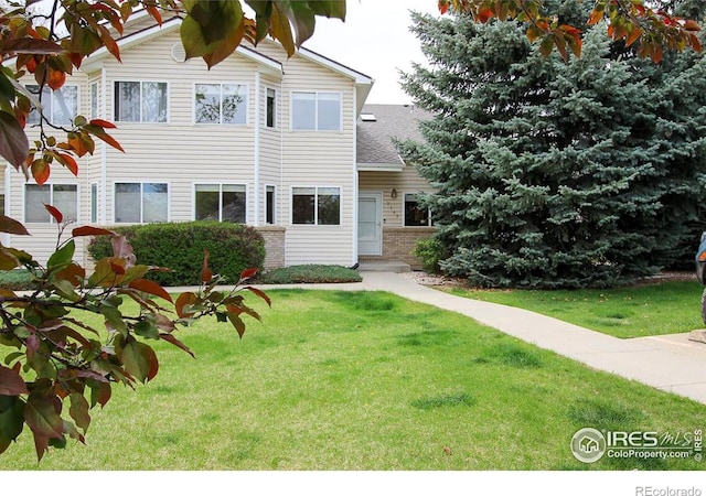 2143 Meadow Ct, Longmont, CO 80501 - view of front of property with a front lawn and brick siding