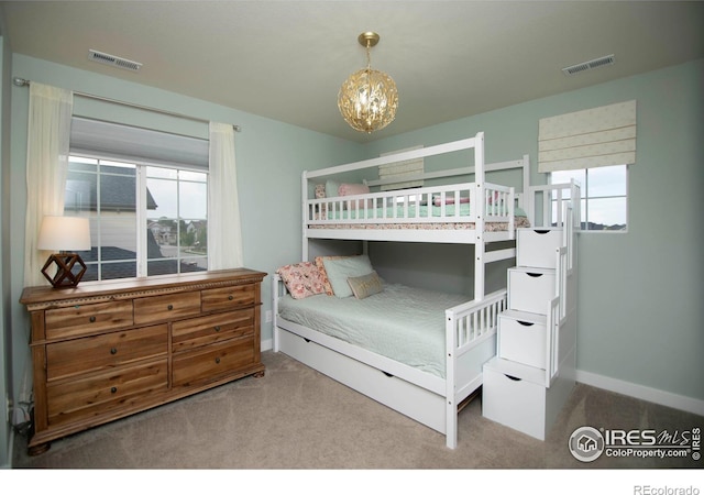 7086 Thunderview Dr, Timnath, CO 80547 - carpeted bedroom featuring a chandelier and baseboards
