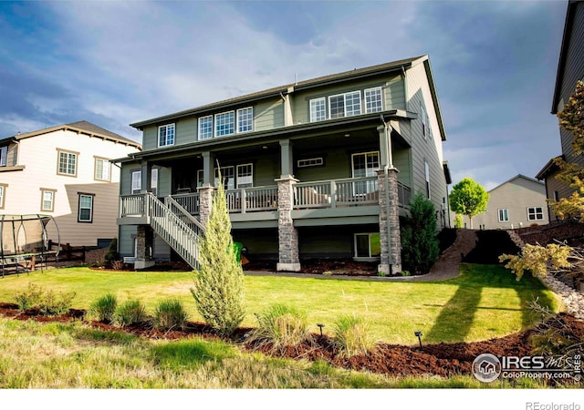 7086 Thunderview Dr, Timnath, CO 80547 - back of property featuring a porch and a lawn