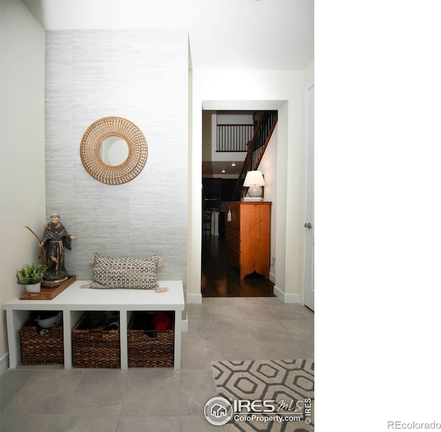 7086 Thunderview Dr, Timnath, CO 80547 - hallway featuring tile patterned floors