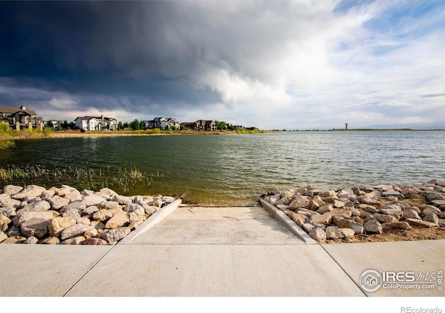 7086 Thunderview Dr, Timnath, CO 80547 - water view featuring nearby suburban area