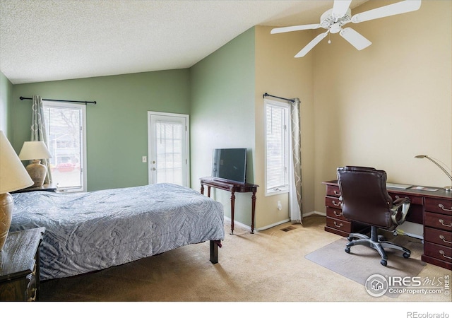 bedroom with lofted ceiling, light carpet, ceiling fan, a textured ceiling, and baseboards