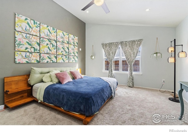 carpeted bedroom with vaulted ceiling, recessed lighting, a ceiling fan, and baseboards