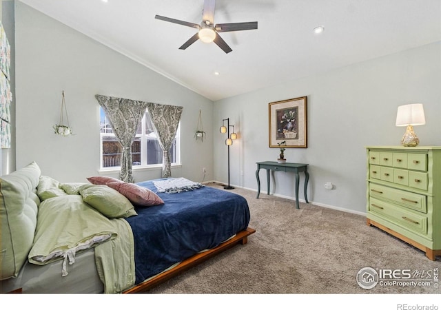 carpeted bedroom featuring lofted ceiling, ceiling fan, and baseboards