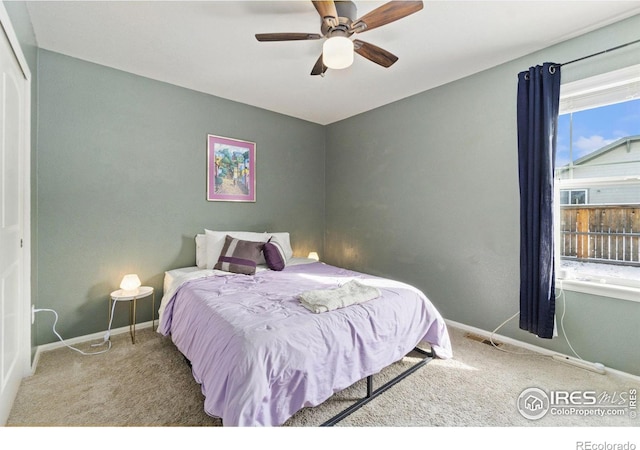 bedroom featuring ceiling fan, carpet floors, and baseboards