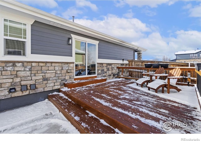 view of snow covered deck