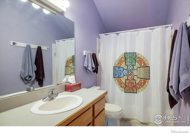 full bathroom featuring tile patterned flooring, vanity, and toilet