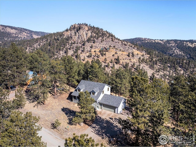 birds eye view of property featuring a mountain view