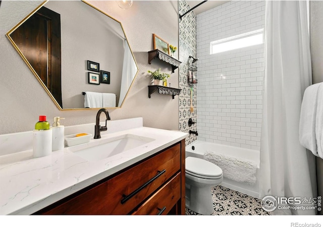full bath featuring vanity, toilet, and shower / bath combination with curtain