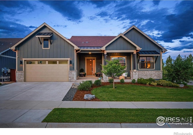 2025 Orchard Bloom Dr, Windsor, CO 80550 - craftsman house with stone siding, a front lawn, and board and batten siding