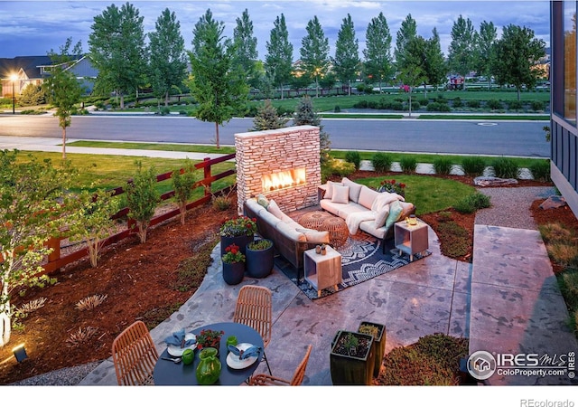2025 Orchard Bloom Dr, Windsor, CO 80550 - view of patio featuring an outdoor living space with a fireplace
